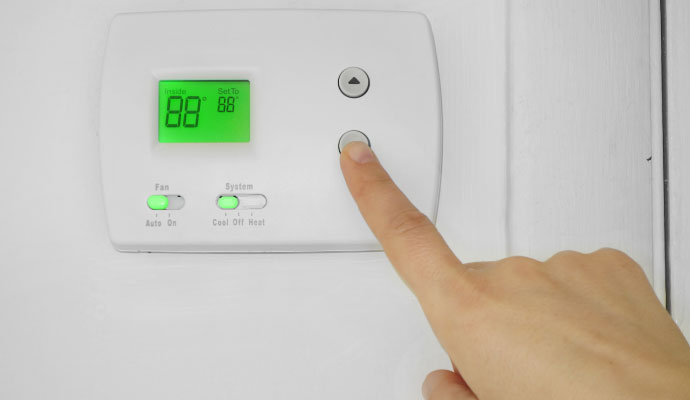 Adjusting digital thermostat temperature