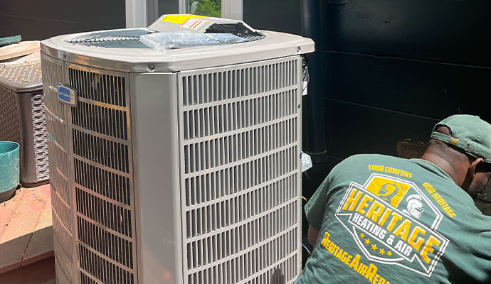 Expert installing central air conditioner