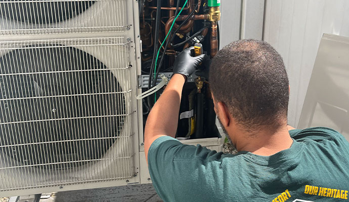 Technician repairing air conditioner