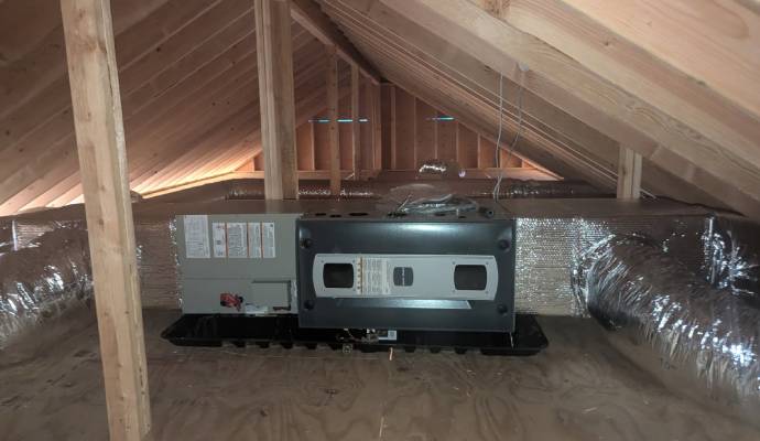 Furnace installed in a residential attic.