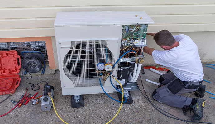 HVAC technician performing system evacuation and pressure check