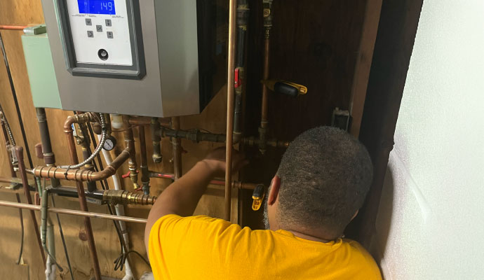 Technician repairing heating system