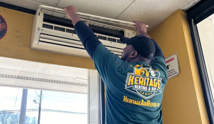Heritage Heating and Air professional repairing AC