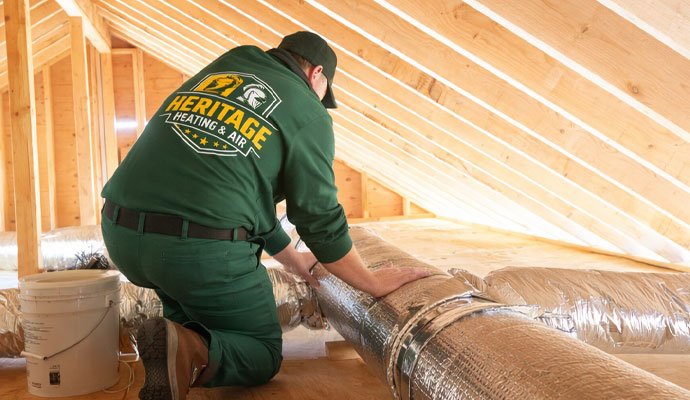 Professional hvac technician sealing air ducts