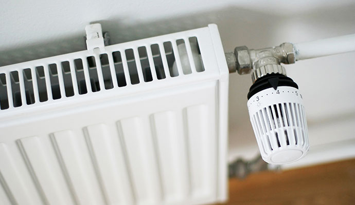 White panel radiator with a thermostatic radiator valve