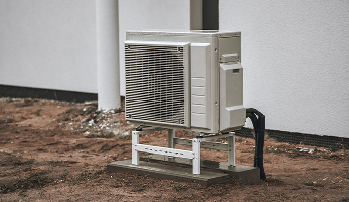 Outdoor AC unit on elevated metal stand
