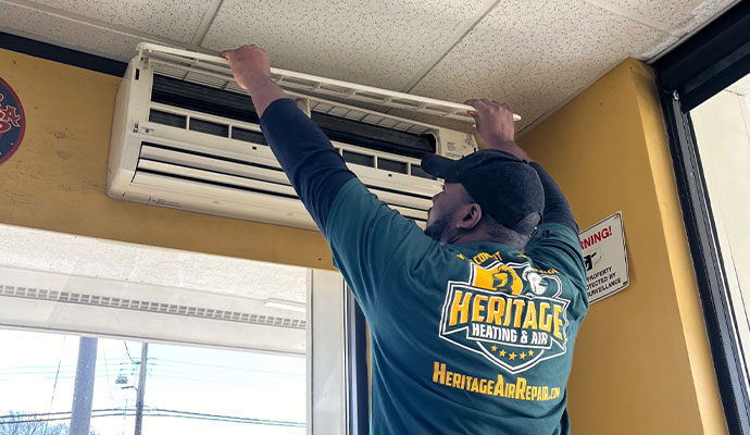 Technician repairing AC