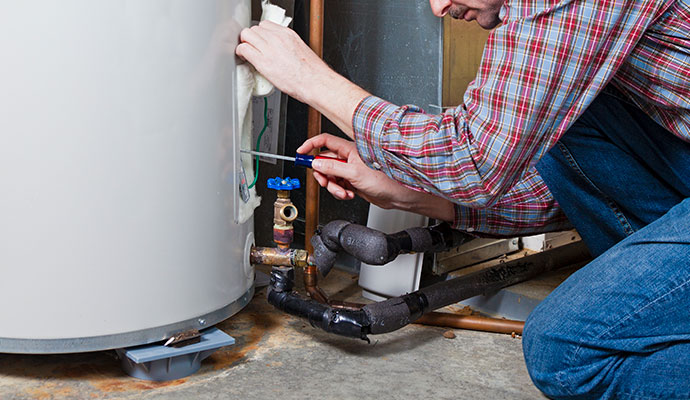 An expert repairing water heater